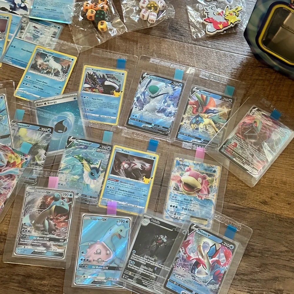 Pokemon Card Collection with Tins and Accessories 25 card Mystery Tin plus bonus